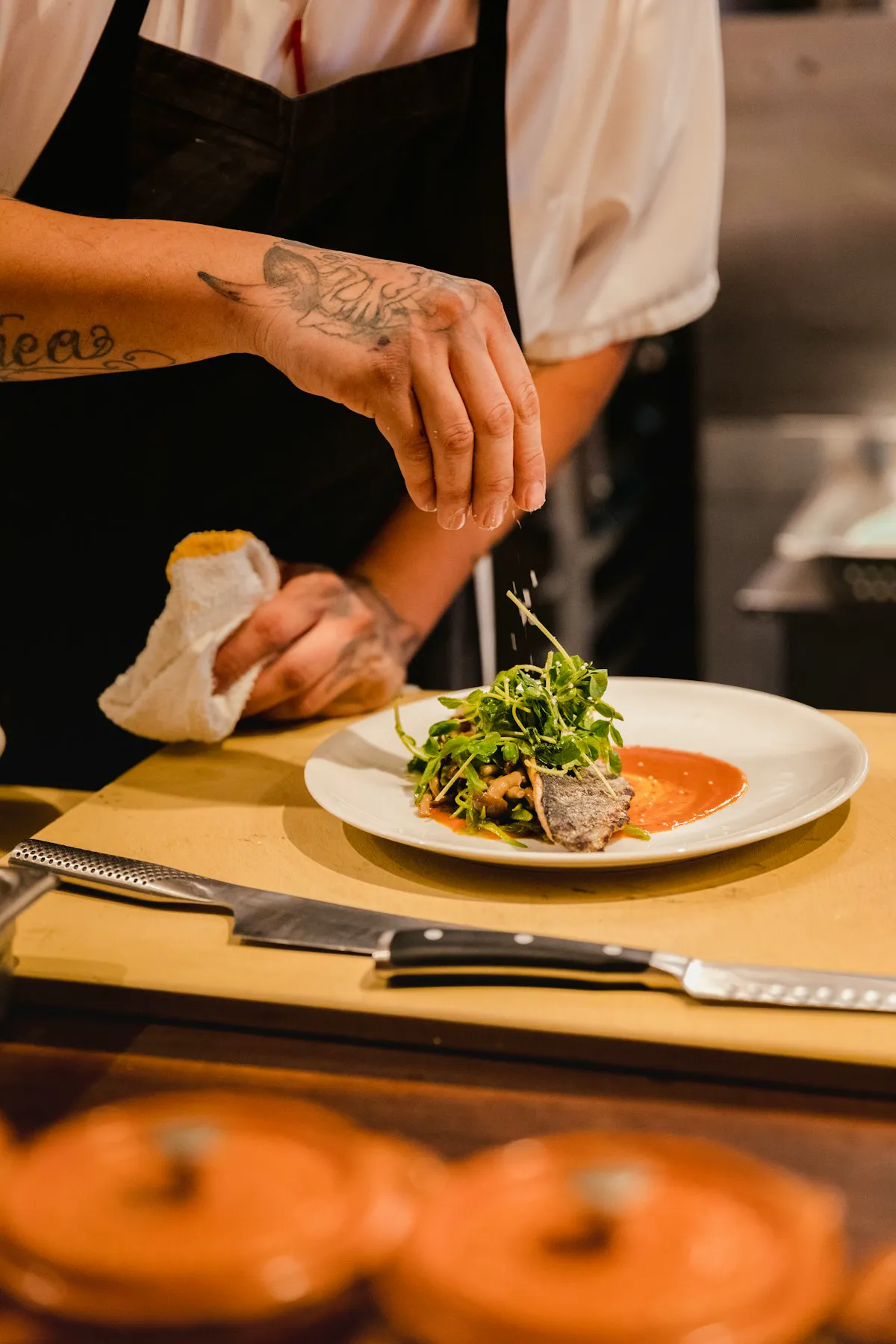 A SAVU cook plating the evening's first course