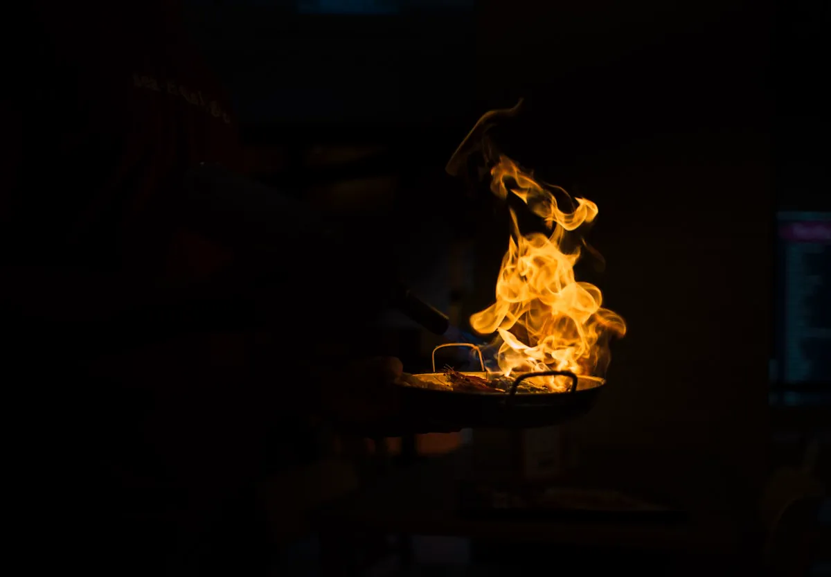 Birch flame burning against the dark of the hearth