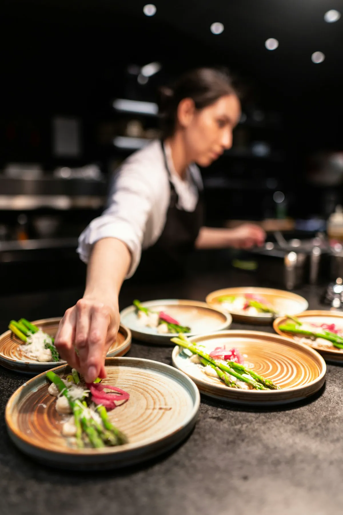 Hands finishing plates seen from above at the SAVU pass